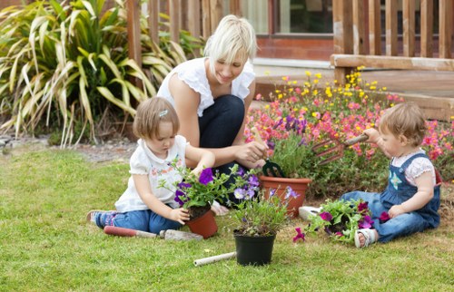 Gardener trimming hedges in Finchley